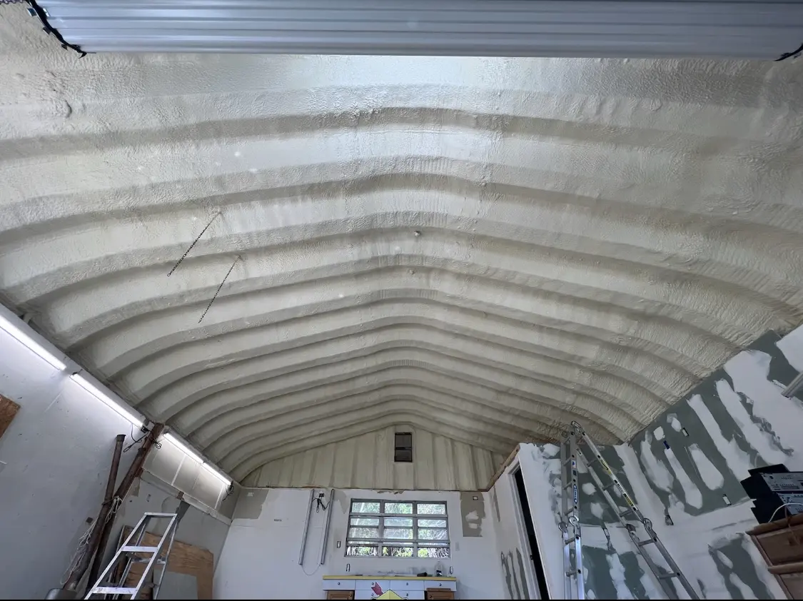 Spray polyurethane foam applied to the underside of a metal roof deck in Santa Fe